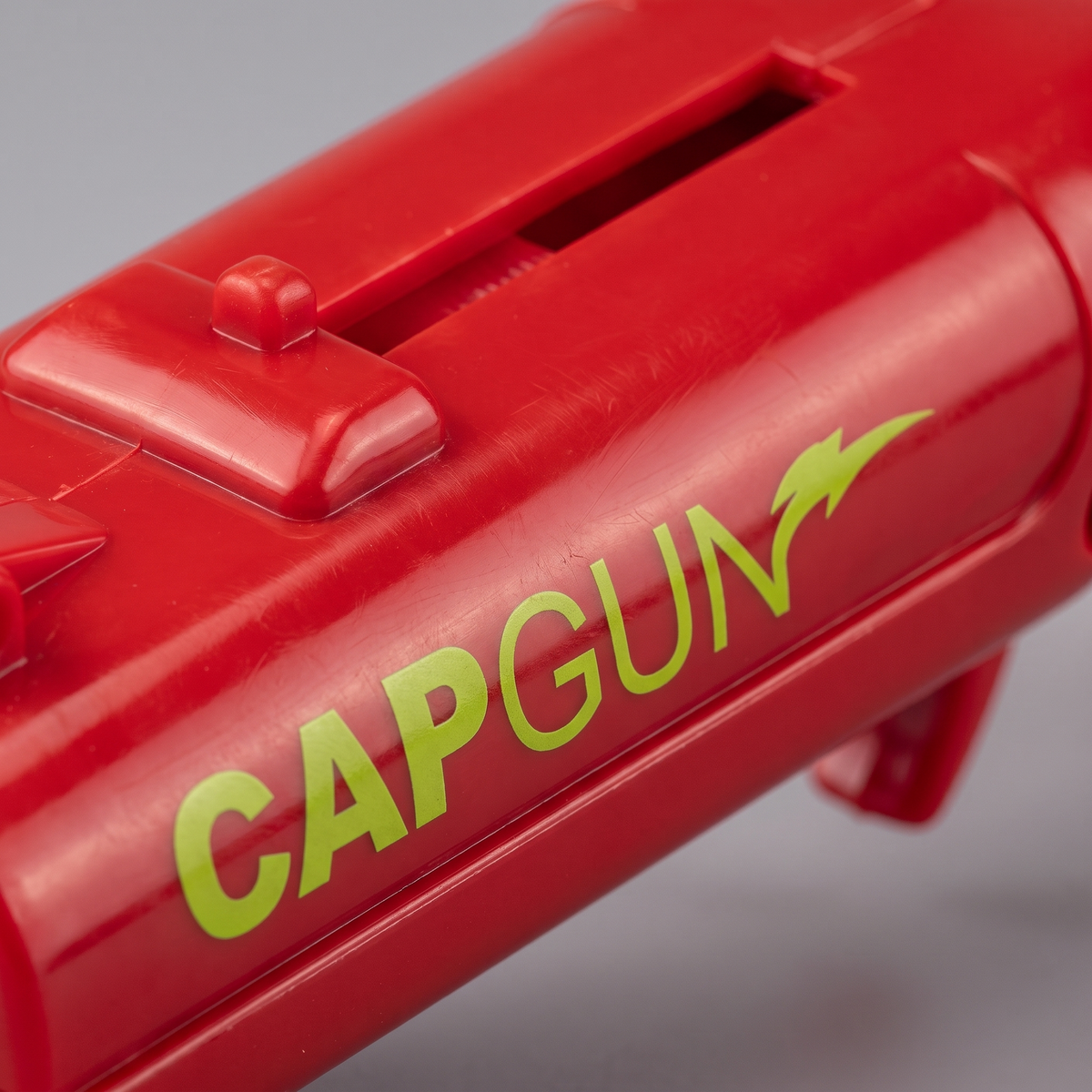 CapGun - Red - lime CAPGUN lettering and eject slider detail